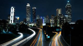 highway and cityscape at night